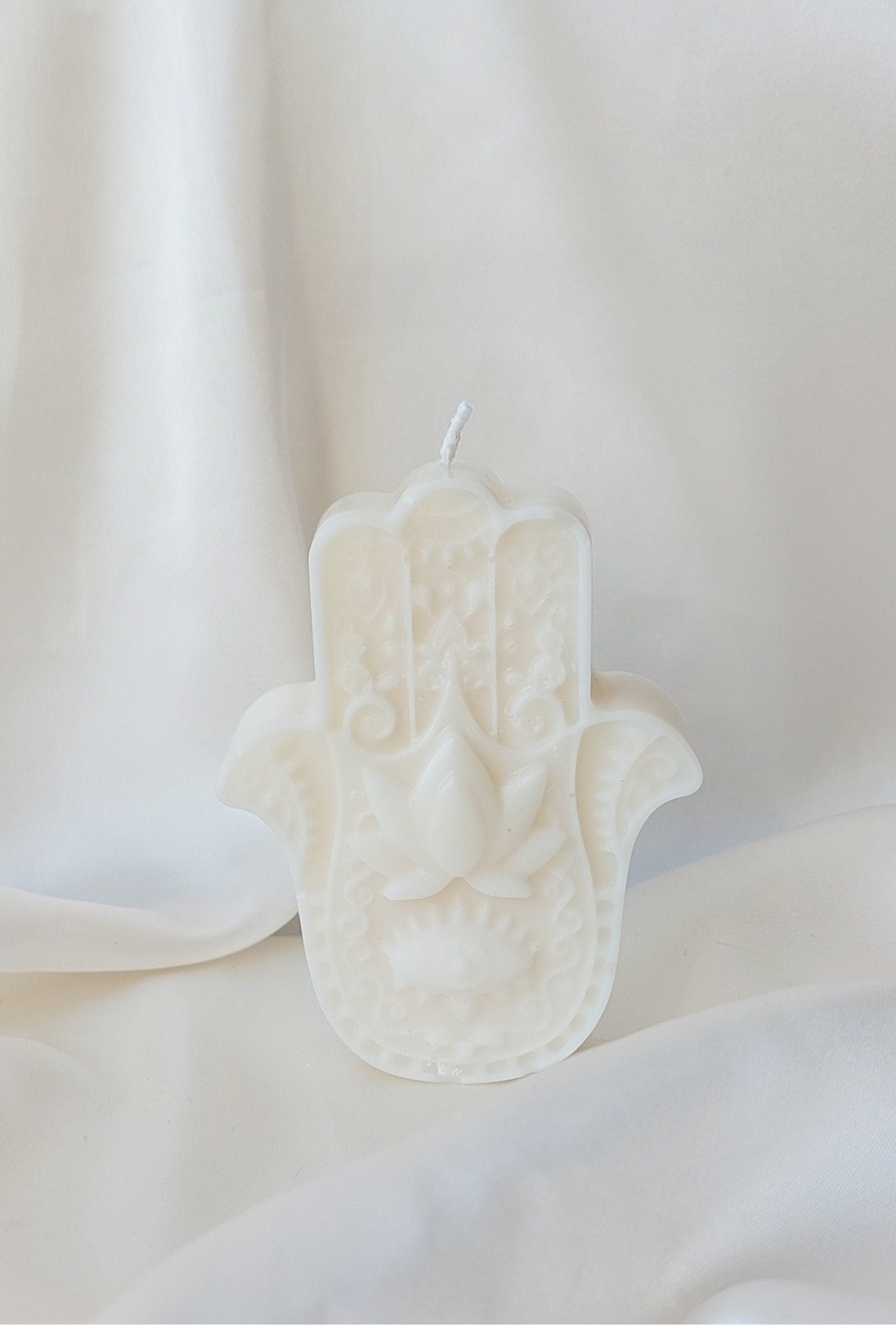 Hand der Fatima Kerze